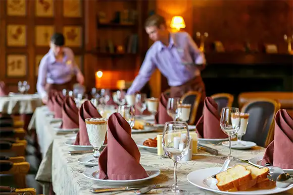 Waiters serve the table