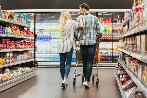 Couple in a retail store shopping in an aisle